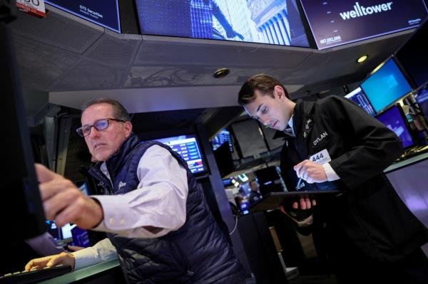 Traders work on the floor of the New York Stock Exchange.