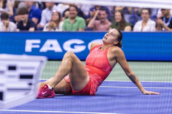 Belarus's Aryna Sabalenka sits on the court after a tough point Monday.