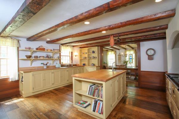 Wooden beams hover over a charming kitchen.