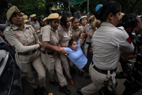 Sakshi Malik, in blue, an Indian wrestler who won a bro<em></em>nze medal at the 2016 Summer Olympics,