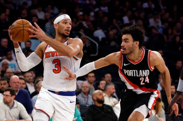 osh Hart #3 of the New York Knicks looks to pass as Justin Minaya #24 of the Portland Trail Blazers defends