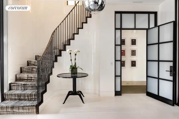 Image of staircase leading to private bedrooms in 9 East 79th Street duplex purchased by Tisch and husband for $8 million in 2011.