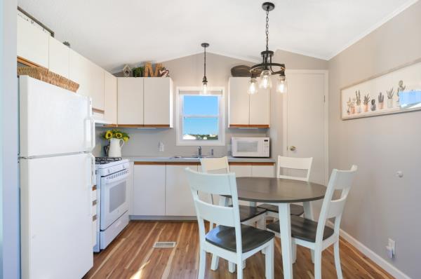 The living area opens to a kitchen.