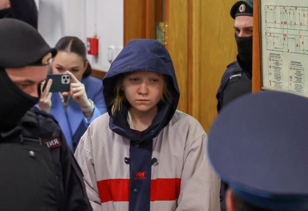 Darya Trepova escorted inside a court building before a hearing in Moscow, Russia, April 4, 2023. 