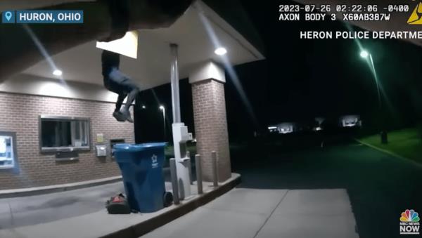 Officers arrived just in time to hear unusual sounds coming from above the bank's drive-thru and witness the access door loudly swing open.