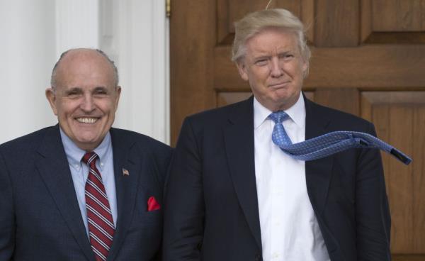 President-elect Do<em></em>nald Trump and former New York City Mayor Rudy Giuliani smiling together at the Trump Natio<em></em>nal Golf Club in Bedminster, New Jersey in 2016