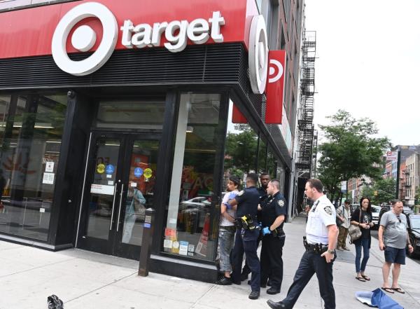 A person being arrested outside a Target store.