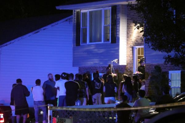 More people gather on a residential street in Annapolis, Md., wher<em></em>e the deadly shooting occurred on June 11, 2023. 