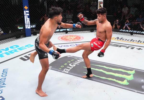 LAS VEGAS, NEVADA – OCTOBER 14: (R-L) Jo<em></em>nathan Martinez kicks Adrian Yanez in a bantamweight fight during the UFC Fight Night event at UFC APEX on October 14, 2023 in Las Vegas, Nevada. (Photo by Chris Unger/Zuffa LLC via Getty Images)