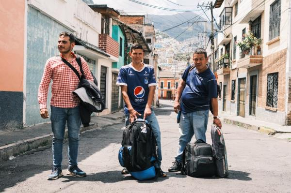 Juan Sebastian Acosta, Johan Rodriguez and Joaquin Rodriguez from Bogota are turned away from a full local migrant shelter in Quito