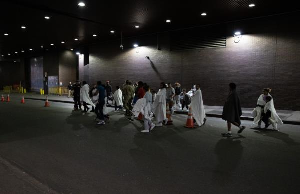 A second bus of migrants arrives at the Port Authority Bus Terminal in Manhattan, Monday, Oct. 9, 2023. 