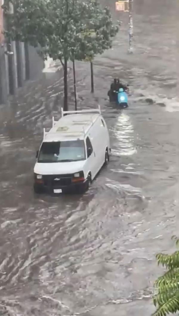 One man was filmed dressed in a banana costume while busting a groove in the knee-deep waters as another person filmed him and o<em></em>nlookers passed by.