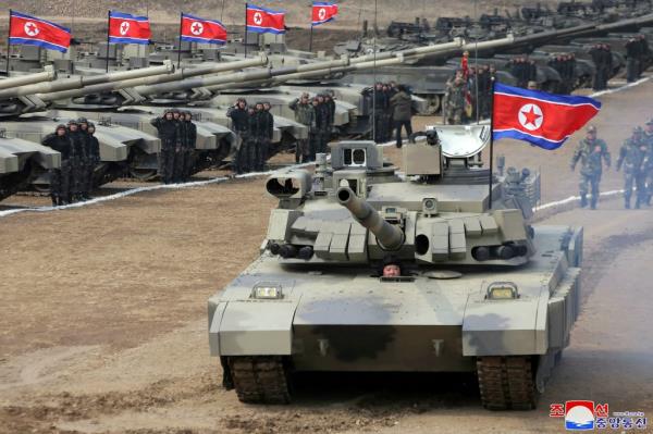 North Korean leader Kim Jong Un drives in a new-type tank during a training exercise on March 13, 2024.