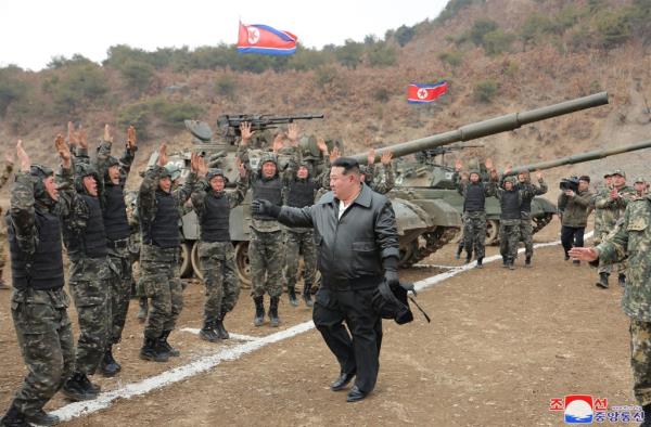 North Korean leader Kim Jong Un walks past military perso<em></em>nnel during a training competition on March 13, 2024.