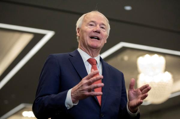 Former Arkansas governor and 2024 Presidential candidate Asa Hutchinson speaks to media following the Republican Party of Iowa legislative breakfast at the Hilton Des Moines Downtown, in Des Moines, Iowa, U.S. January 8, 2024.