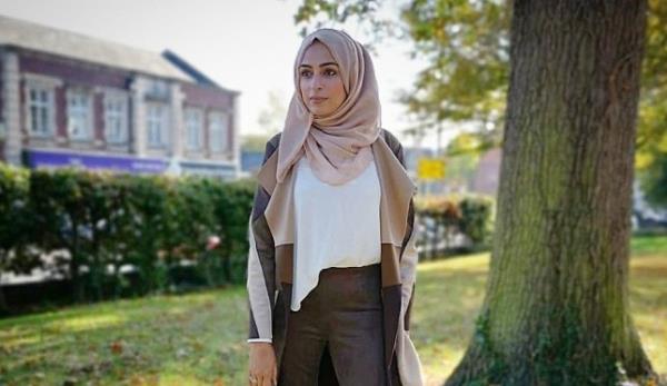 Bushra wearing the hijab in front of a tree