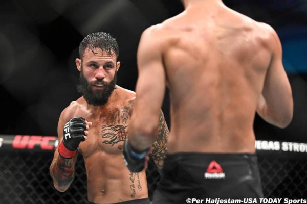 Sep 28, 2019; Copenhagen, DEN; Brandon Davis (red gloves) fights Giga Chikadze (blue gloves) during UFC Fight Night at Royal Arena. Mandatory Credit: Per Haljestam-USA TODAY Sports