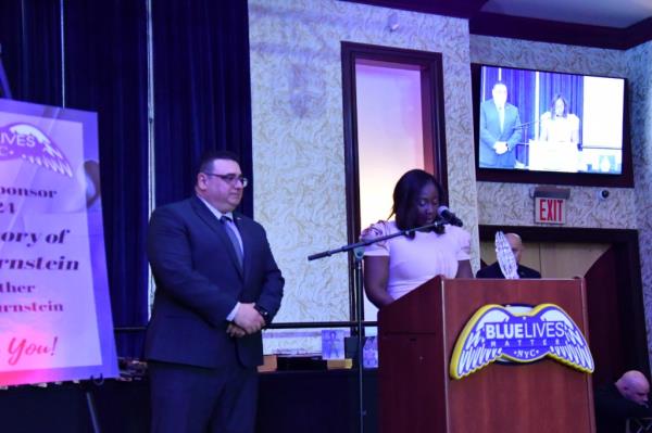 Veve's wife Esther addressing the attendees at the gala.