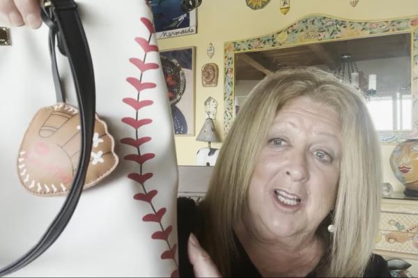 elayne boosler holding a bag