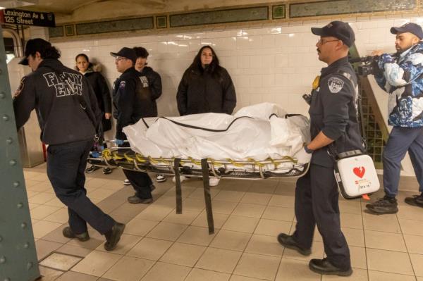 FDNY, EMT's and MTA and NYPD at the scene of a person hit  and killed by the uptown 5 train 