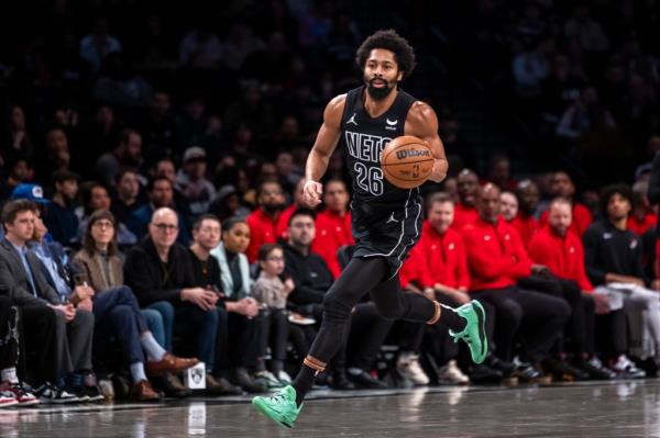 Nets guard Spencer Dinwiddie (26) drives up court in the first half against the Portland Trail Blazers