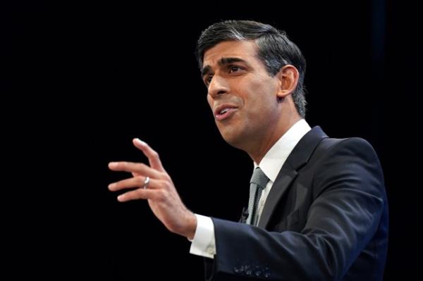 Prime Minister Rishi Sunak gestures as he speaks during the final day of the Co<em></em>nservative Party Co<em></em>nference on October 4, 2023 in Manchester, England.