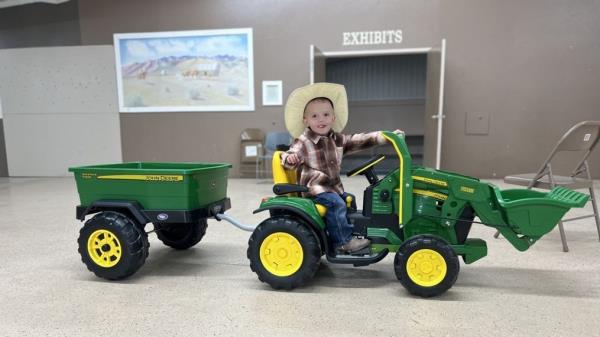 The boy was hospitalized after he drove his toy tractor into a river and spent an unknown amount of time submerged earlier this week.