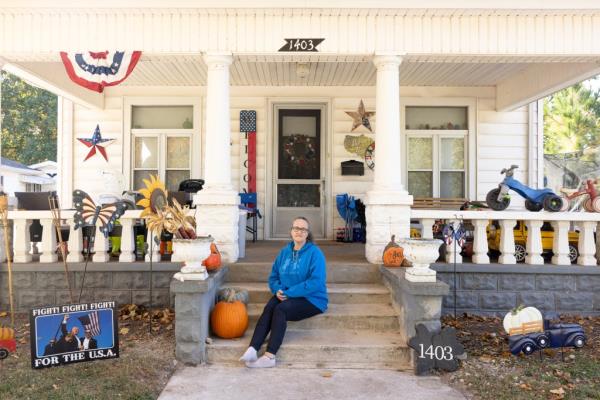 Nancy Baker, 44, sits outside her home on the front step.