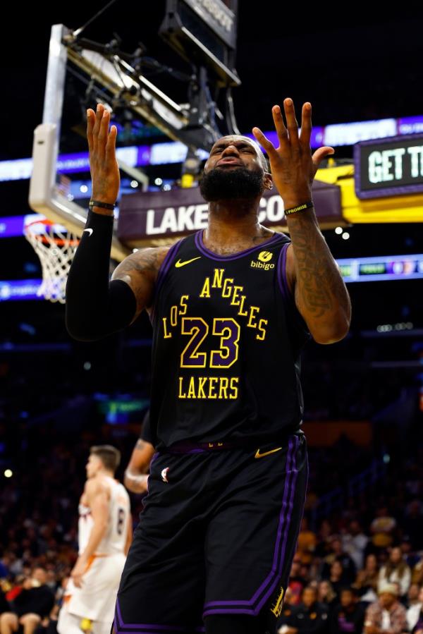 LeBron James #23 of the Los Angeles Lakers reacts after being fouled against the Phoenix Suns 