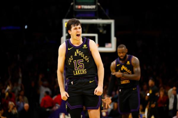 Austin Reaves #15 of the Los Angeles Lakers celebrates a 3-point shot against the Phoenix Suns