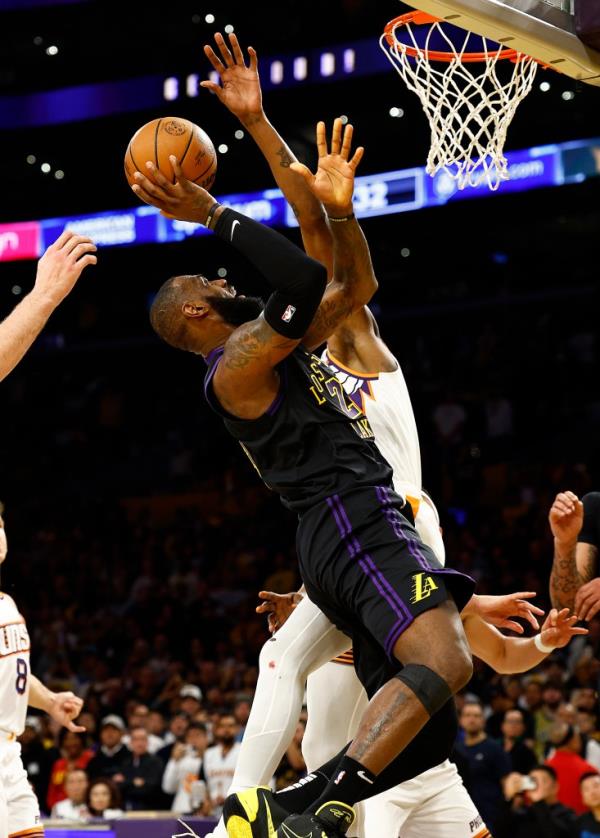 LeBron James #23 of the Los Angeles Lakers takes a shot against the Phoenix Suns in the second half during the 2023 NBA In-Season Tournament quarterfinals 