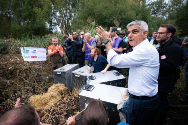 Lo<em></em>ndon mayor Sadiq Khan helps release a family of beavers at Paradise Fields in Ealing