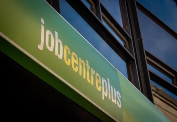 BATH, UNITED KINGDOM - MARCH 18: The Jobcentre Plus logo is seen outside an employment office on March 18, 2023 in Bath, England. Formed in 2002 and part of the Department for Work and Pensions (DWP), Jobcentre Plus is a government-funded employment agency and social security office that can be found in most cities in the UK, whose aim it is to help people of working age find employment in the UK. (Photo by Matt Cardy/Getty Images)