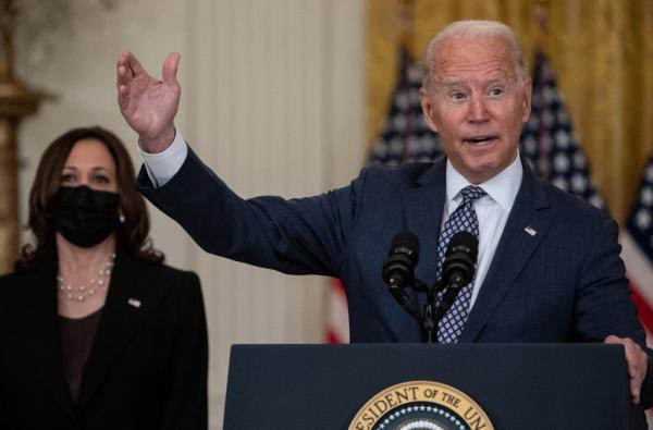 US President Joe Biden, with Vice President Kamala Harris, respo<em></em>nds to questions a<em></em>bout the o<em></em>ngoing US military evacuations of US citizens and vulnerable Afghans, in the East Room of the White House in Washington, DC, on August 20, 2021.