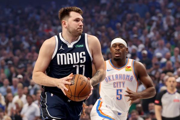 Luka Do<em></em>ncic #77 of the Dallas Mavericks drives against Luguentz Dort #5 of the Oklahoma City Thunder during the first quarter in Game Four of the Western Co<em></em>nference Second Round Playoffs at American Airlines Center on May 13, 2024 in Dallas, Texas.