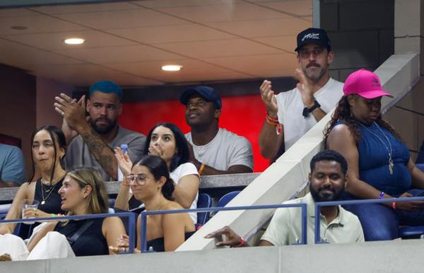 Aaron Rodgers and his Jets teammates cheer on Novak Djokovic at the U.S. Open on Sunday.