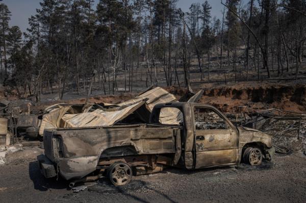 A car burned by the wildfire in Alto.