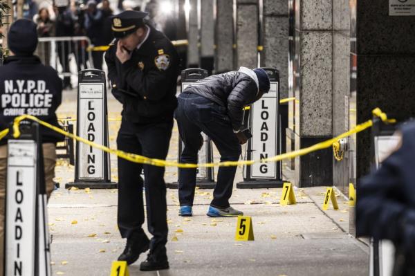 Detectives ands members of the New York City police department's Crime Scene Unit 