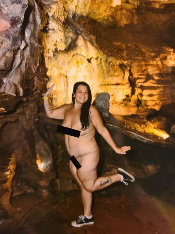 Cave craver Ostrander shows her enthusiasm for the nude excursion.