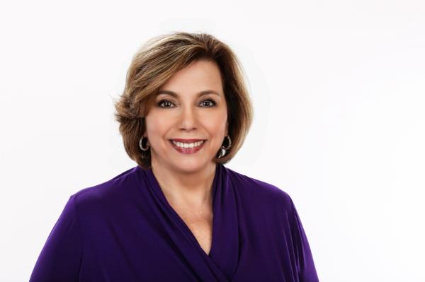 Georgia radio host Martha Zoller in a purple shirt preparing for her morning interview with Mark Cuban