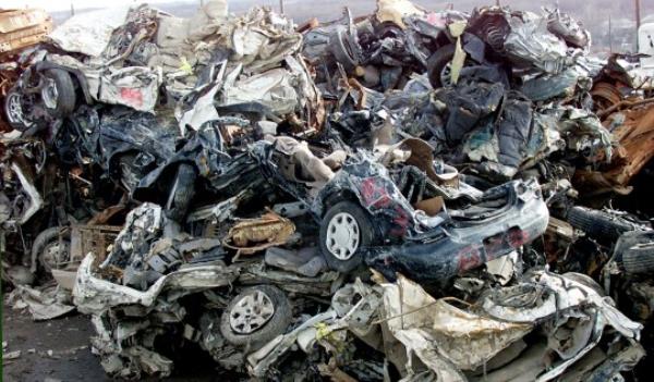 NEW YORK, UNITED STATES: Smashed vehicles recovered from the World Trade Center site are stacked at Fresh Kills Landfill in New York 14 January, 2002. The wreckage and rubble from the World Trade Center attacks 11 September 2001 are sent to Fresh Kills wher<em></em>e crews are picking through the rubble and are setting aside thousands of sad mementos of the tragedy. Crews working at ground zero have removed 951,272 tons of debris and steel as of 03 January, according to city officials. AFP PHOTO/Don EMMERT (Photo credit should read DON EMMERT/AFP via Getty Images)