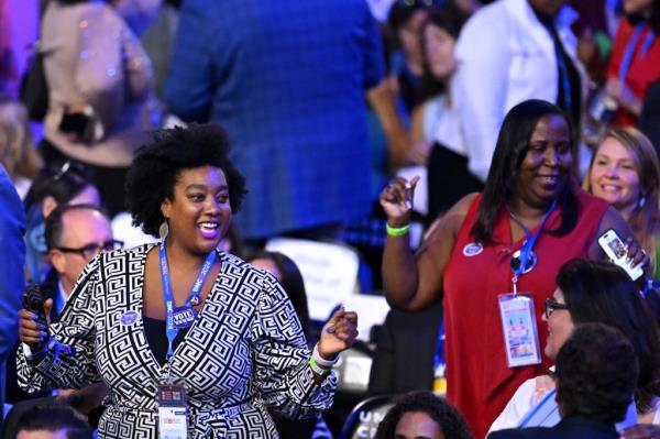 Delegates dance on the second day of the Democratic Natio<em></em>nal Co<em></em>nvention (DNC) at the United Center in Chicago, Illinois, on August 20, 2024.