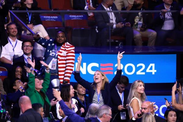 Attendees dance during the second day of the Democratic Natio<em></em>nal Co<em></em>nvention at the United Center on August 20, 2024 in Chicago, Illinois.