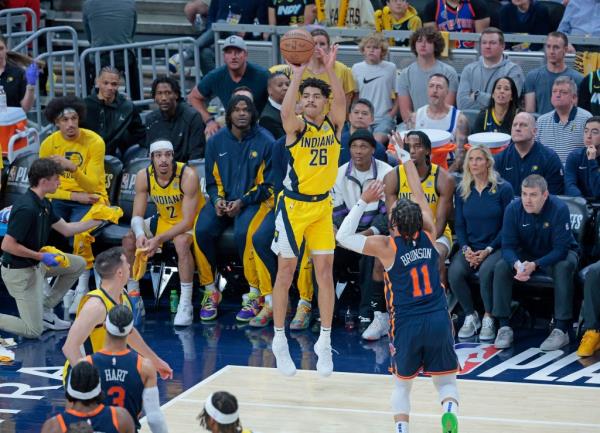 Ben Sheppard #26 of the Indiana Pacers puts up a three point shot over Jalen Brunson #11 of the New York Knicks during the first quarter of Game 4.