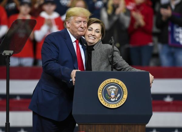 Do<em></em>nald Trump and Kim Reynolds