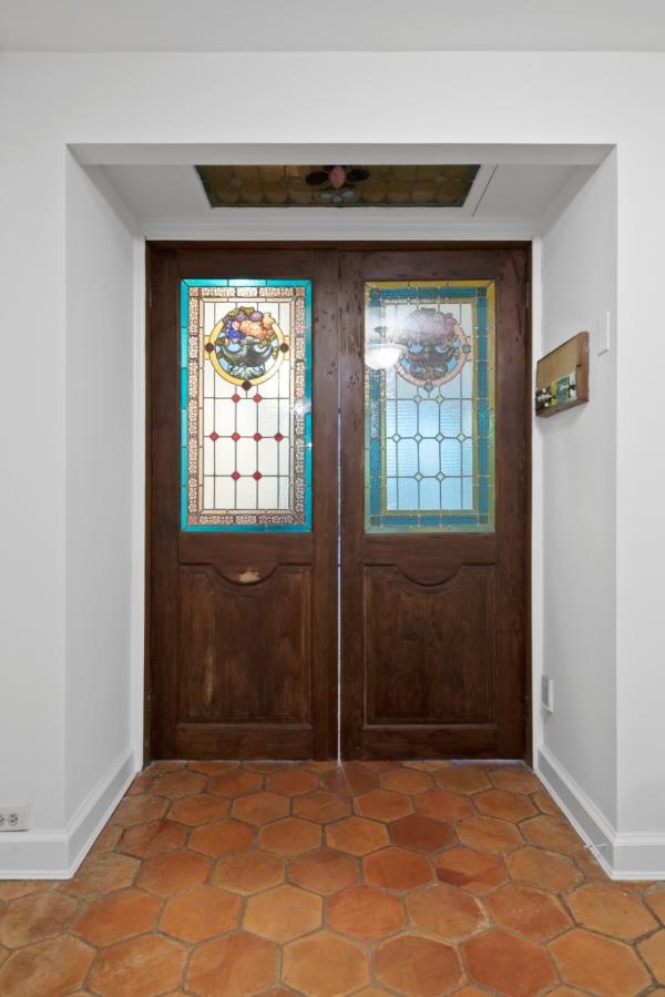 The landmarked home boasts historic details like original stained glass.