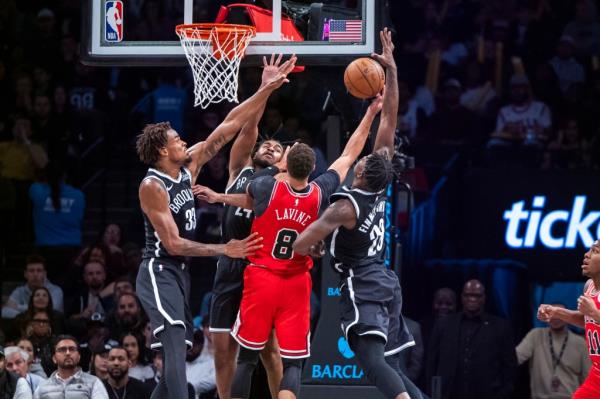 Brooklyn Nets center Nic Claxton (33), guard Cam Thomas (24) and forward Dorian Finney-Smith (28) defend Chicago Bulls guard Zach LaVine (8) in the second half at Barclays Center, Friday, Nov. 1, 2024, in Brooklyn, NY. 