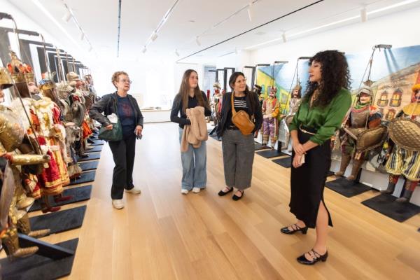 Palladino (left) showing around Zoe and Morgan Dunn (middle) at the museum on Monday.