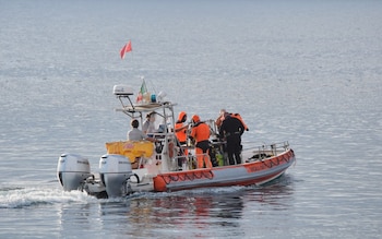 A boat carrying a dive team heads out to the site of the Bayesian on the fourth day of the search and recovery operation