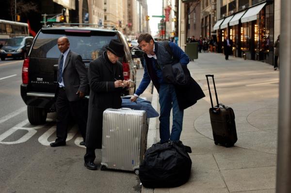 Bellhop assisting Cem Boyner with his luggage outside the Four Seasons Hotel in New York, o<em></em>nce the most expensive hotel in NYC, in April 2013.